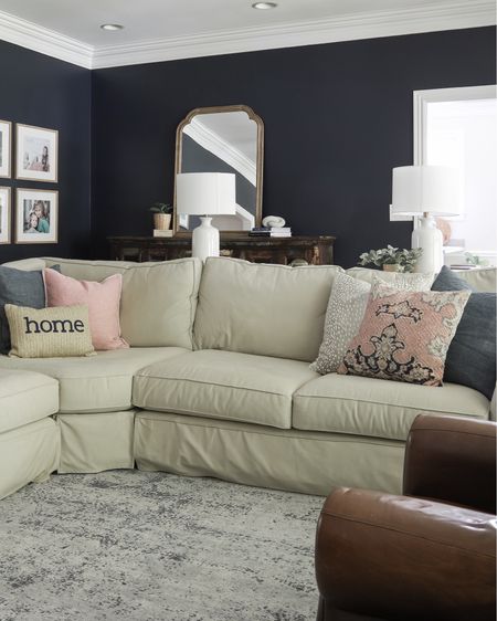 My blue/gray Oriental rug brightens my navy-walled living room. It is durable and still looks great. 

#LTKhome