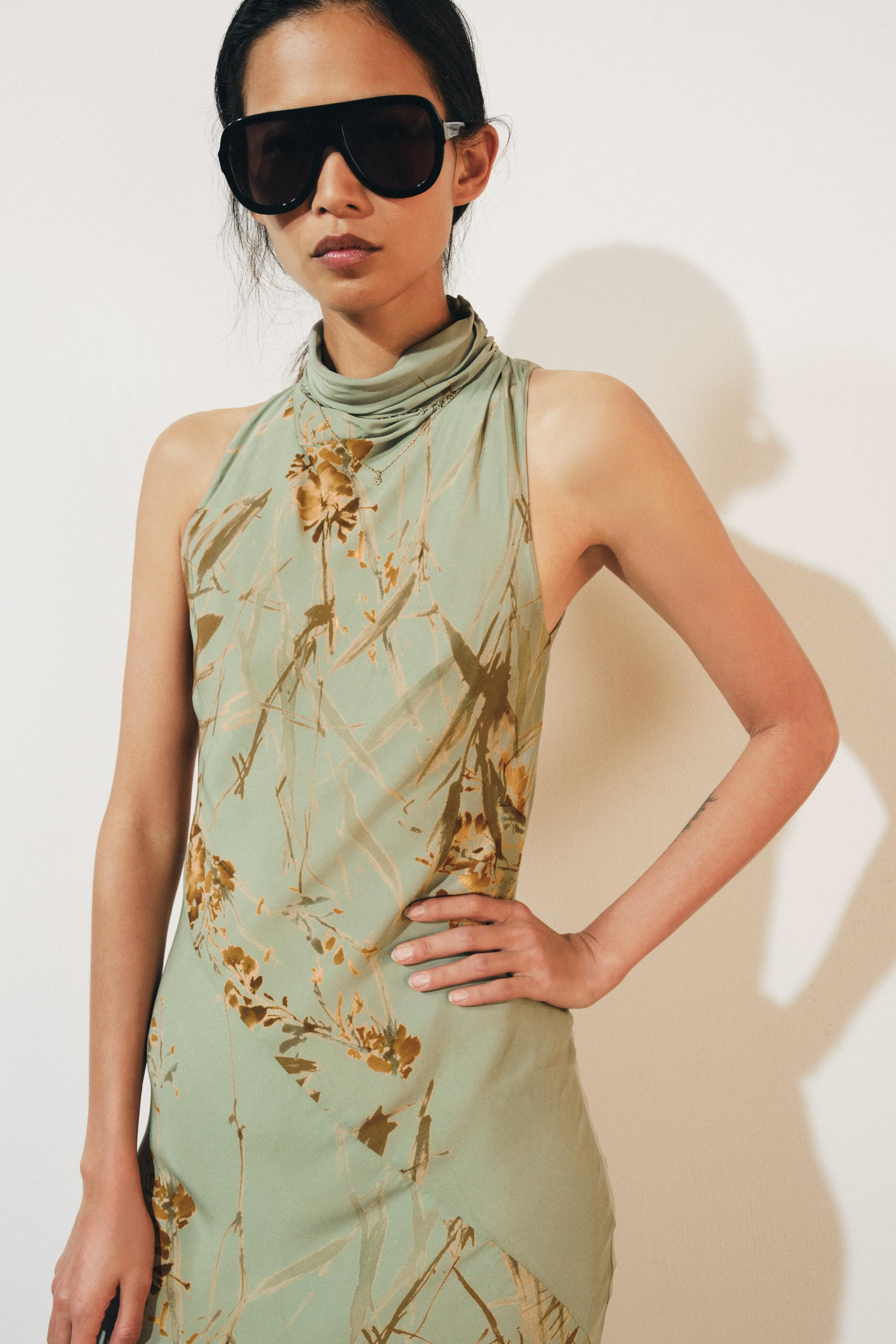 ZARA WOMAN COLLECTION. Dress crafted from viscose yarn. Features a high neck and sleeveless desig... | Zara US