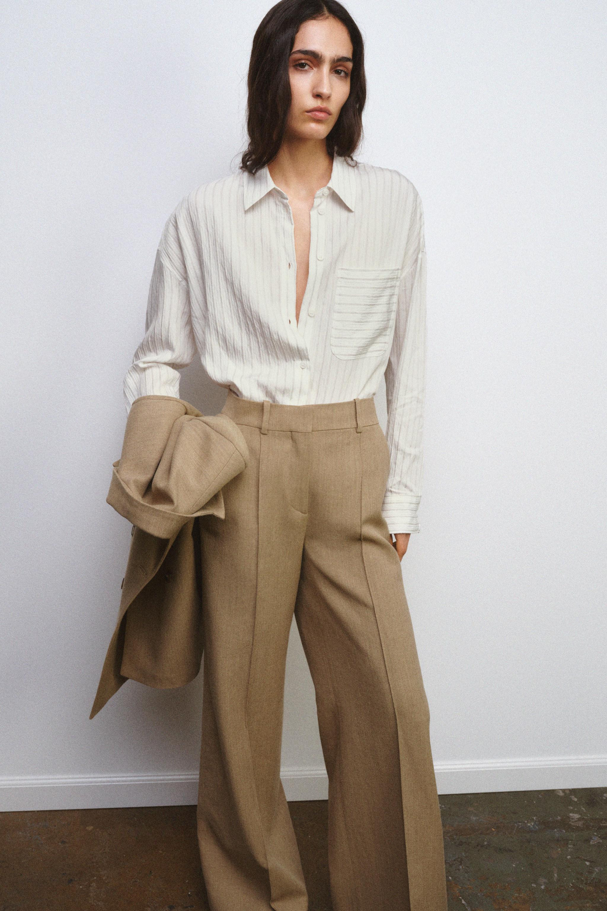 Lapel collar shirt with long sleeves and wide cuffs. Front button closure. | Zara US