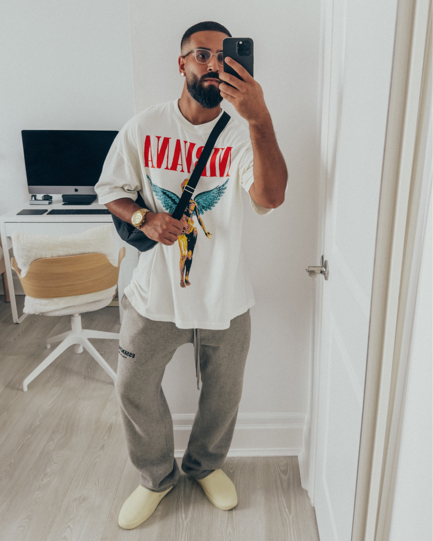 REVOLVE MAN SIXTHREESEVEN Nirvana T-shirt in ‘White’ (size XL). ESSENTIALS Relaxed Sweatpants in ‘Dark Heather Oatmeal’ (size M). FEAR OF GOD California 1.0 slides in ‘Cream’ (size 41). FEAR OF GOD x BARTON PERREIRA glasses in ‘Matte Taupe’. THE ROW Slouchy Banana Bag in ‘Black’. A relaxed and elevated men’s look that’s great for a day of running errands. Size up by 1-2 size for an oversized fit in the tee. The tee is currently sold out so I have linked another band tee in white for a similar look.

#LTKmens #LTKfindsunder100 #LTKstyletip