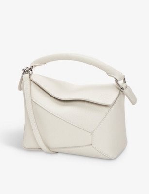 Puzzle mini leather cross-body bag | Selfridges