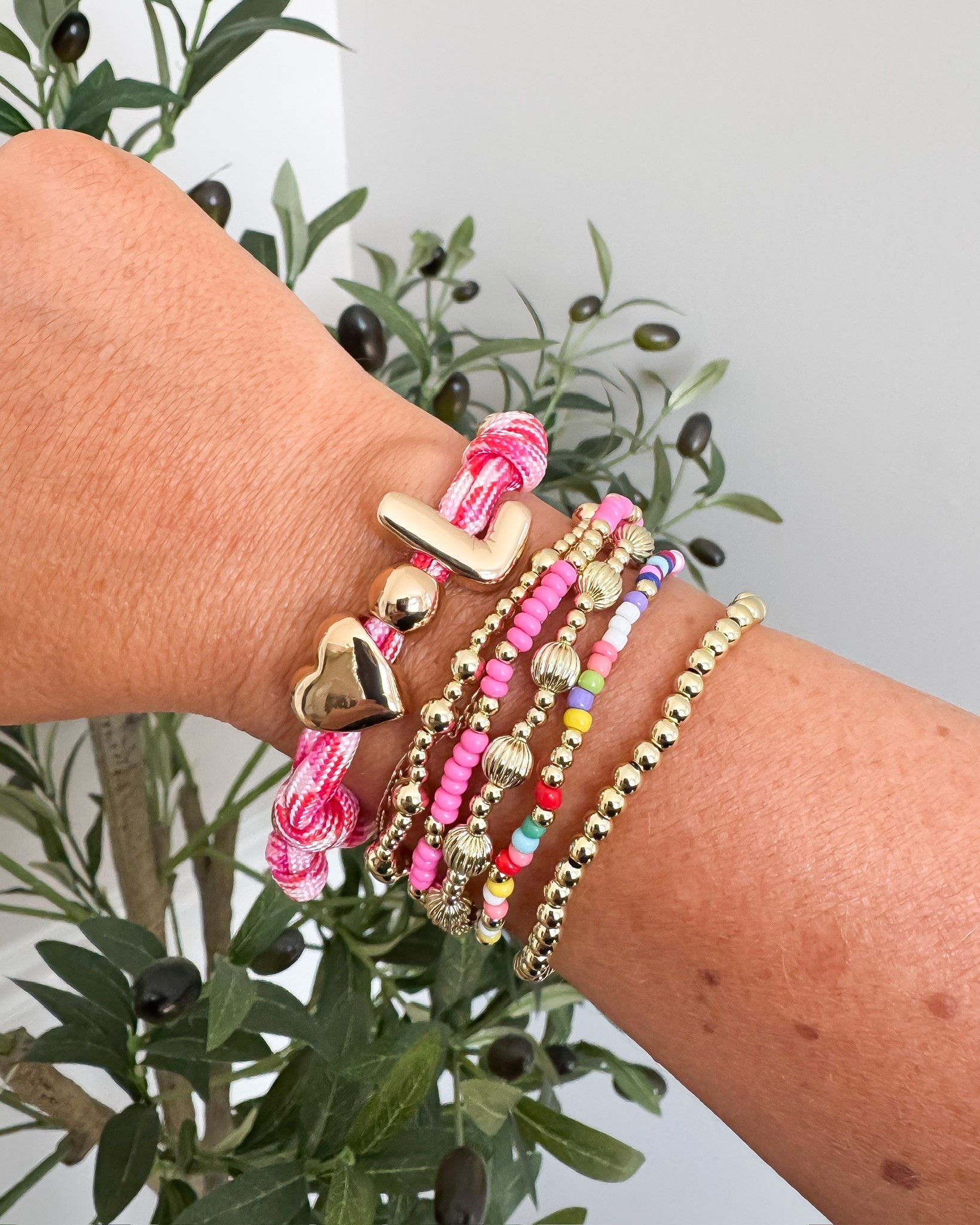 These bracelets are such a fun way to add a pop of color to any outfit! I love mixing the colorful beads with the gold details, and the pink cord bracelet makes the stack feel extra playful. An easy accessory that instantly pulls a look together.

bracelet stack, colorful jewelry, statement accessories, everyday jewelry, layered bracelets, gold jewelry, summer accessories, colorful beads, jewelry finds, outfit details, affordable accessories, lovelylifestyling

#LTKOver40 #LTKmomlife #LTKSeasonal