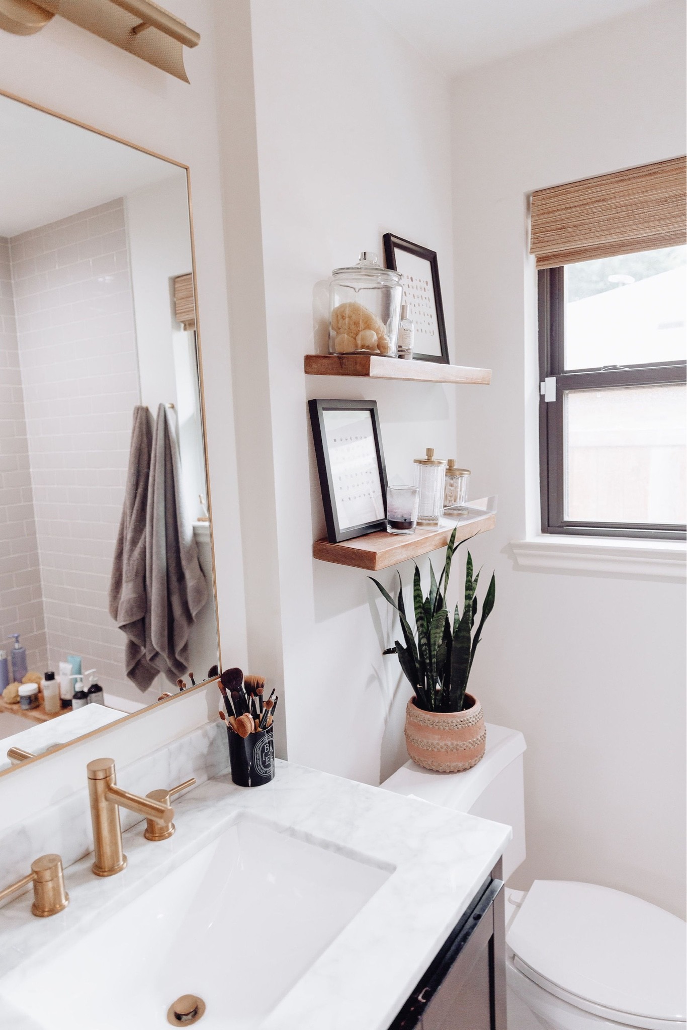 Bathroom // bathroom decor, bath, powder room, home decor, modern home decor, mirror, floating shelves, shelving, vanity, wall art, modern art, decorating, towels, rugs, neutrals, neutral home, decor, modern, minimalist, minimalist style, wall hanging decor, boho decor, neutrals, interior, interior design

#LTKhome