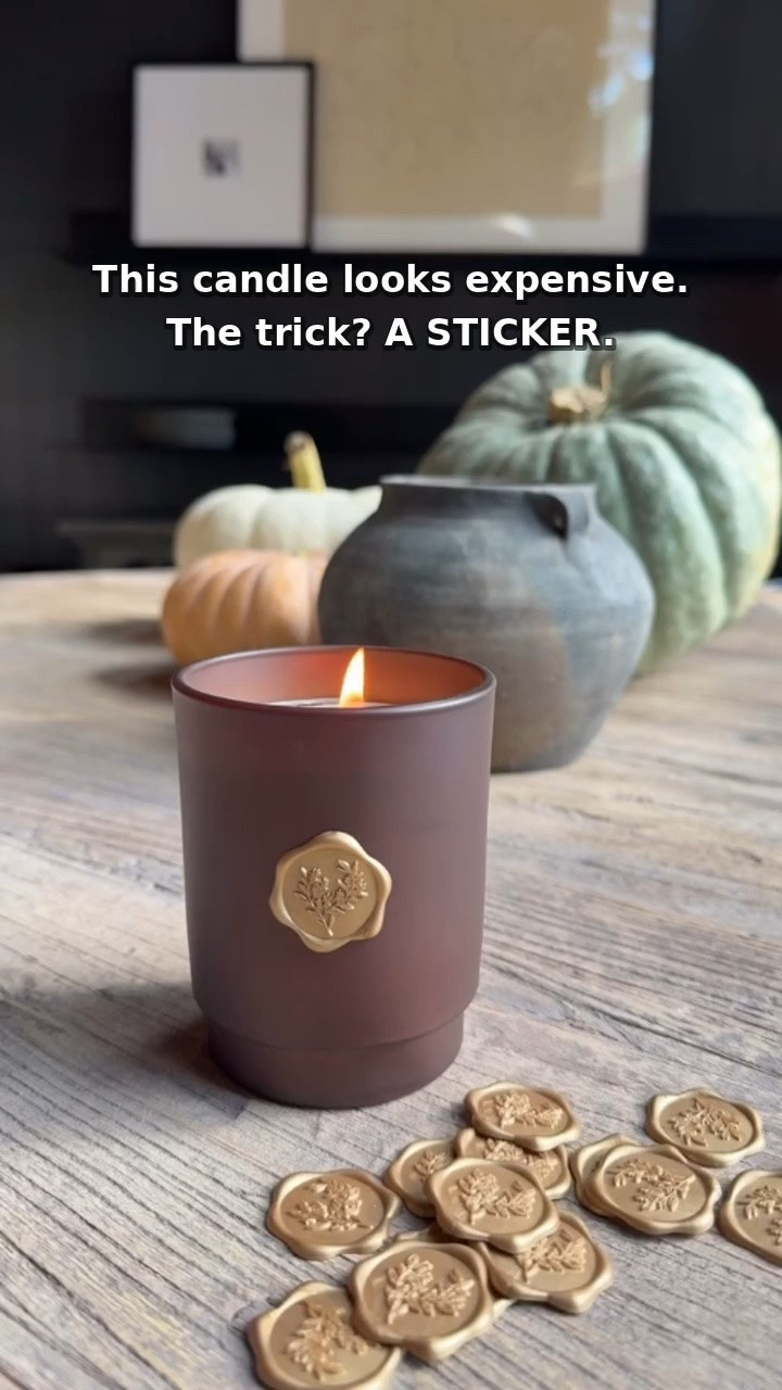 Easy Candle Makeover With Peel-and-Stick Wax Seals

A basic candle gets a boutique look with one simple detail! These gold wax seal stickers come in a pack of 50—just remove the candle’s label, peel, and press. No melting wax or messy cleanup. Perfect for candle makeovers, gift wrap, jars, envelopes, and holiday place cards. Shop the seals below to try this easy DIY!
