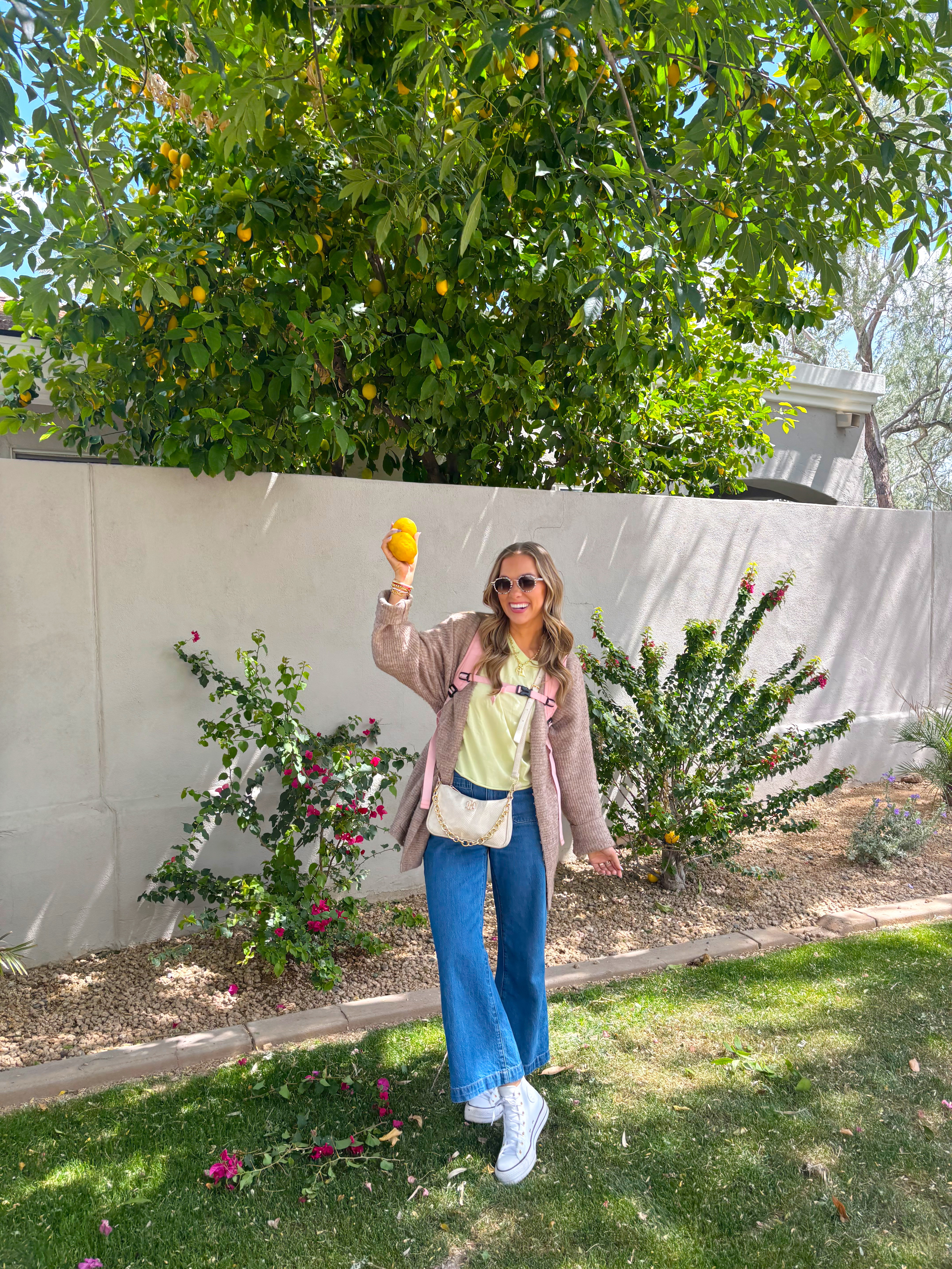 When life gives you lemons...

Just ordered this top to wear hiking, but ended up dressing it up with jeans and I love it! The back is SO cute, and reminds me of a very popular brand... I am wearing a medium!

These are my FAV jeans ever! I'm wearing a size 27, and would say they run true to size! 

Travel outfit
jeans
converse
free people 
KREWE 

 #LTKActive #LTKFindsUnder100 #LTKStyleTip