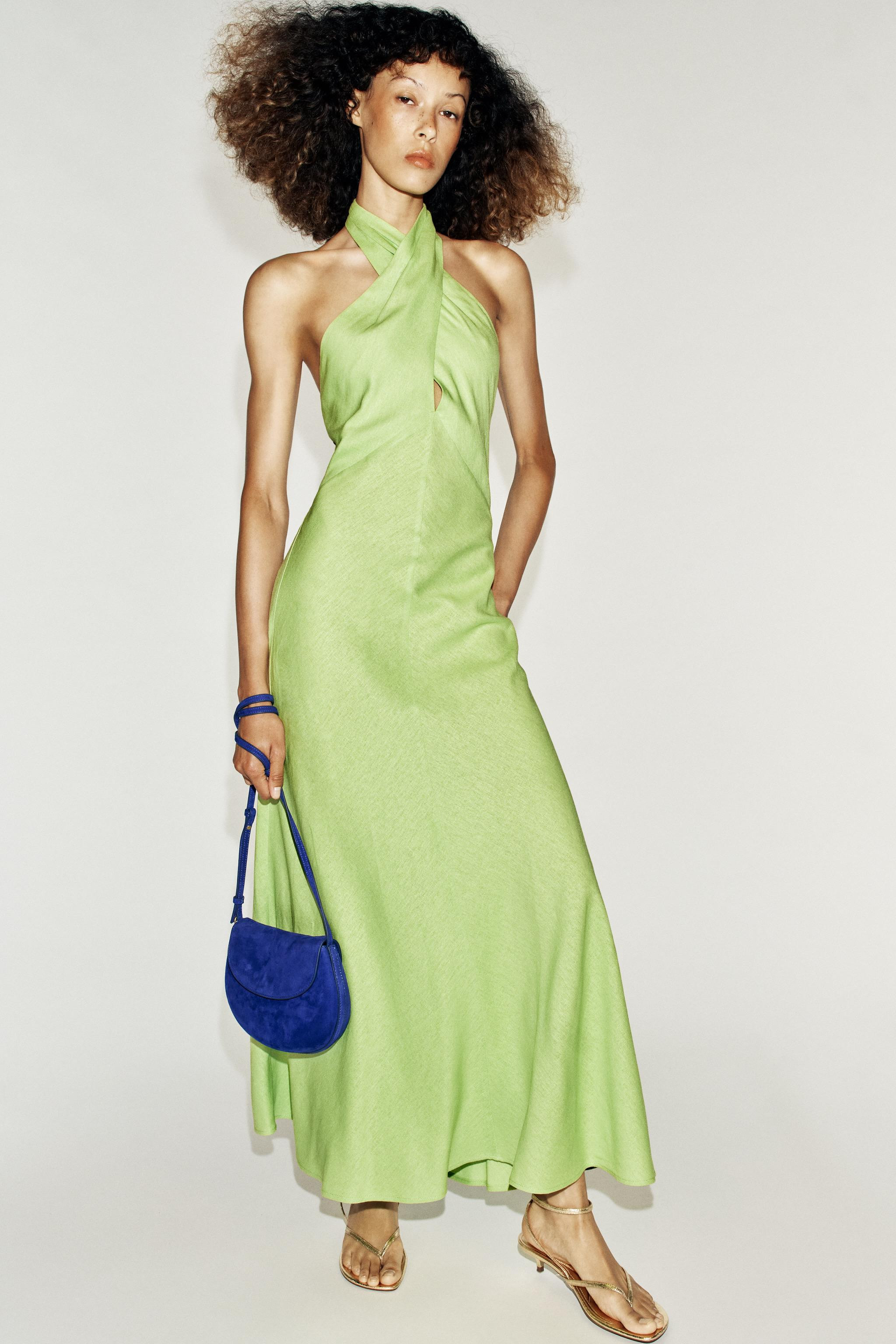 Dress made of linen blend. Halter neck with crossover front. Open back. Flared hem. Back fastenin... | Zara UK