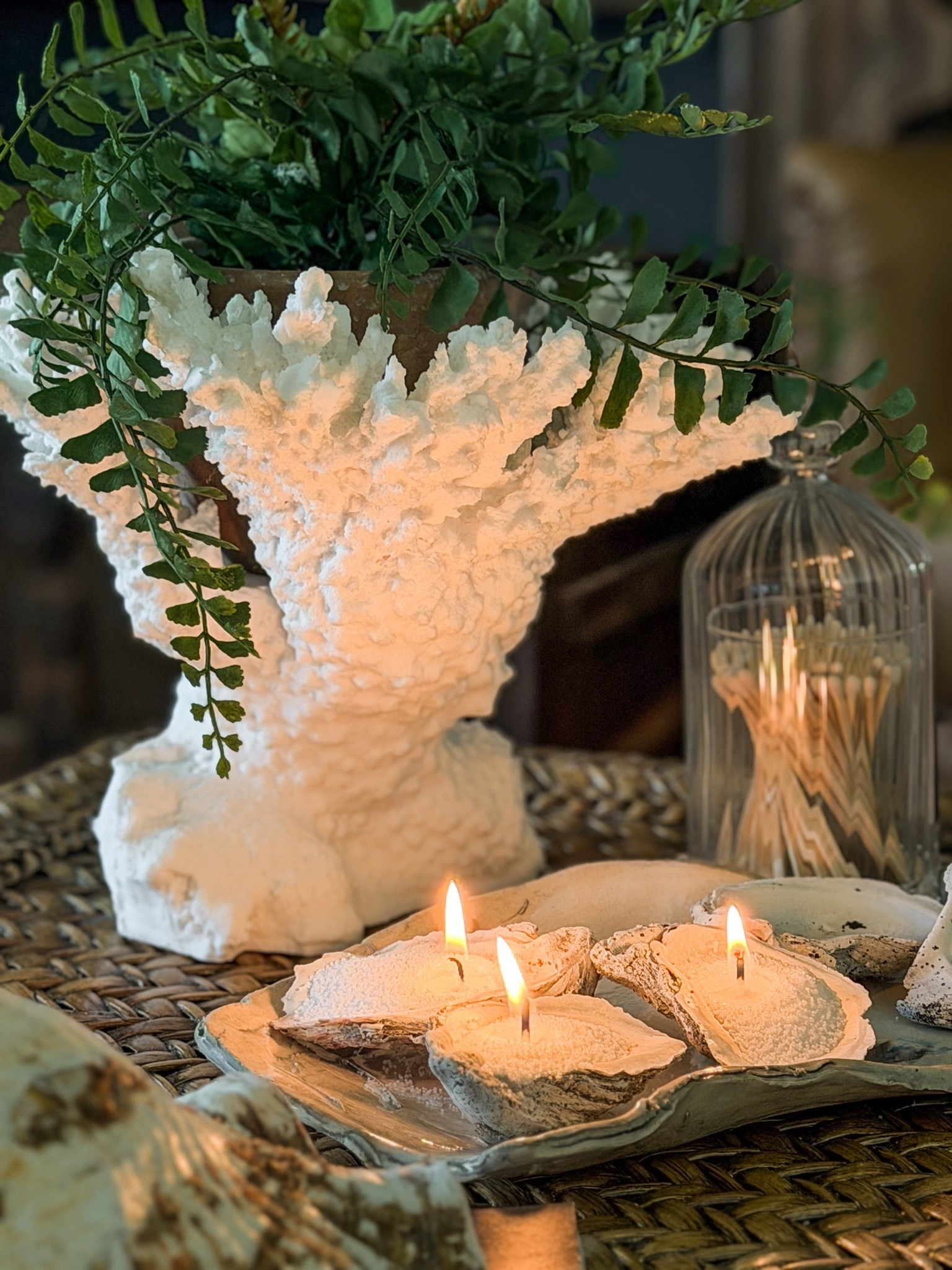 One of my favorite parts of summer living on the coast is collecting shells & bringing a little piece of those beach days back home with me.

After seeing my friend Stephanie use candle sand, I instantly started thinking about how I could create my own cottage coastal version. A few locally collected oyster shells, candle sand, & wicks later, this simple summer centerpiece came to life.

The oyster shaped tray was handcrafted by a local potter, & I completely fell in love with it the moment I saw it. It felt like the perfect piece to pair with treasures collected along our Carolina coast.

I love finding ways to think outside the box with decorating, especially when the pieces tell a story.

And if you’re not visiting the coast this summer, don’t worry. I’ve found some shells for you friend. 🤍

#LTKHome #LTKSeasonal