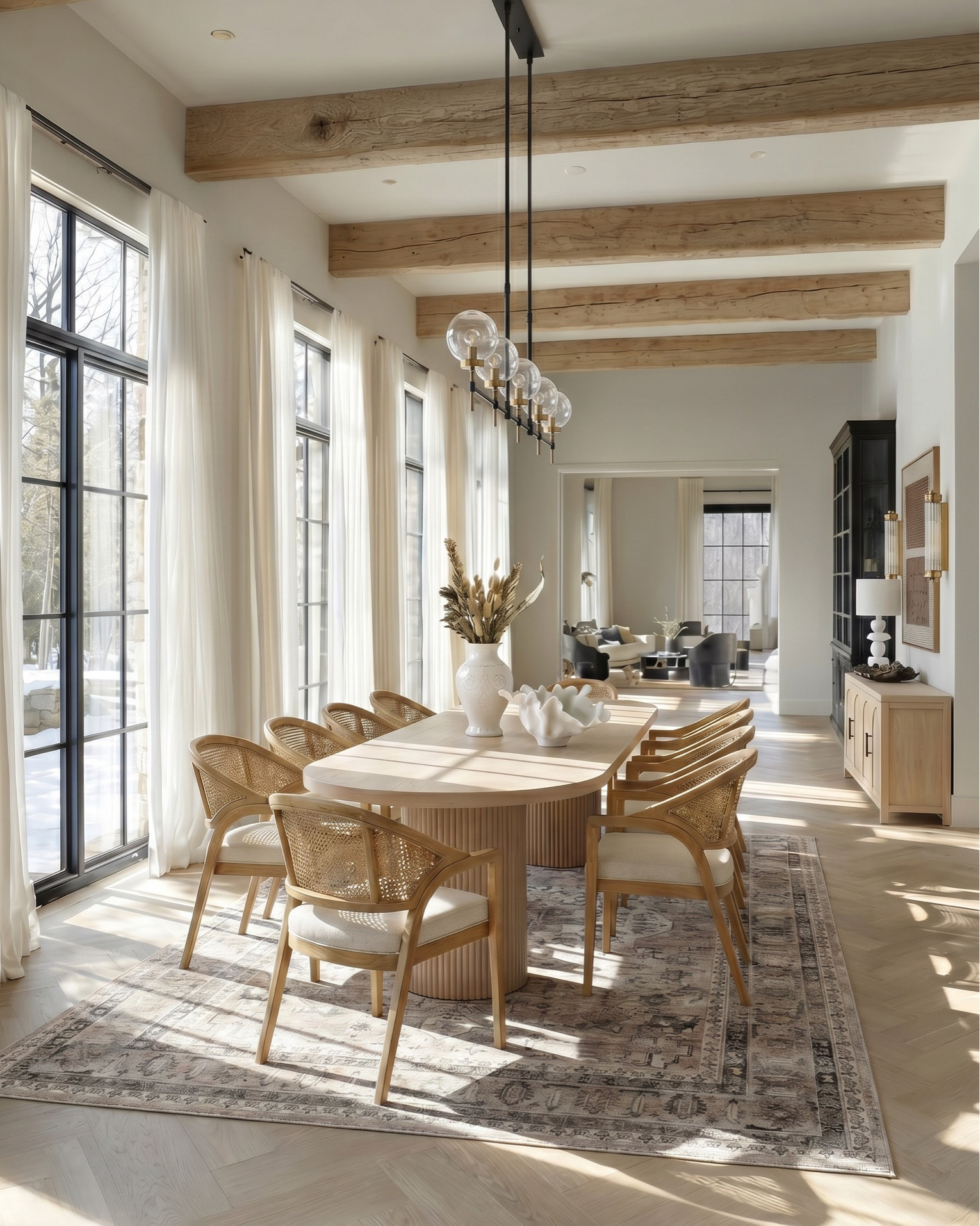 Shop the look:
* Light wood dining table
* Oval wood dining table
* Fluted pedestal dining table
* Natural oak dining table
* Scandinavian dining table
* Modern organic dining table
* Cane back dining chairs
* Woven rattan dining chairs
* Light wood dining chairs upholstered seat
* Minimalist dining chairs set of 6
* Wooden sideboard cabinet
* Light oak buffet cabinet
* Modern farmhouse sideboard
* Glass door display cabinet / black cabinet
* Linear globe chandelier
* Modern black chandelier dining room
* Glass globe pendant light
* Minimalist linear suspension light
* Contemporary dining room lighting fixture
* Brass and black light fixture
* Long rectangular chandelier
* White ceramic vase large
* Neutral vase decor
* Dried pampas grass arrangement
* Dried floral stems decor
* Organic modern centerpiece
* Sculptural white bowl decor
* Decorative coffee table bowl
* Minimalist table decor styling
* Neutral home accessories
* Modern ceramic decor objects
* Vintage neutral area rug
* Beige traditional rug
* Distressed Persian style rug
* Large dining room rug neutral
* Earth tone patterned rug
* Washable vintage rug
* Sheer white curtains floor to ceiling
* Linen curtain panels neutral
* Light filtering curtains modern
* Black window frames modern farmhouse

#LTKhome #LTKsale #LTKstyletip