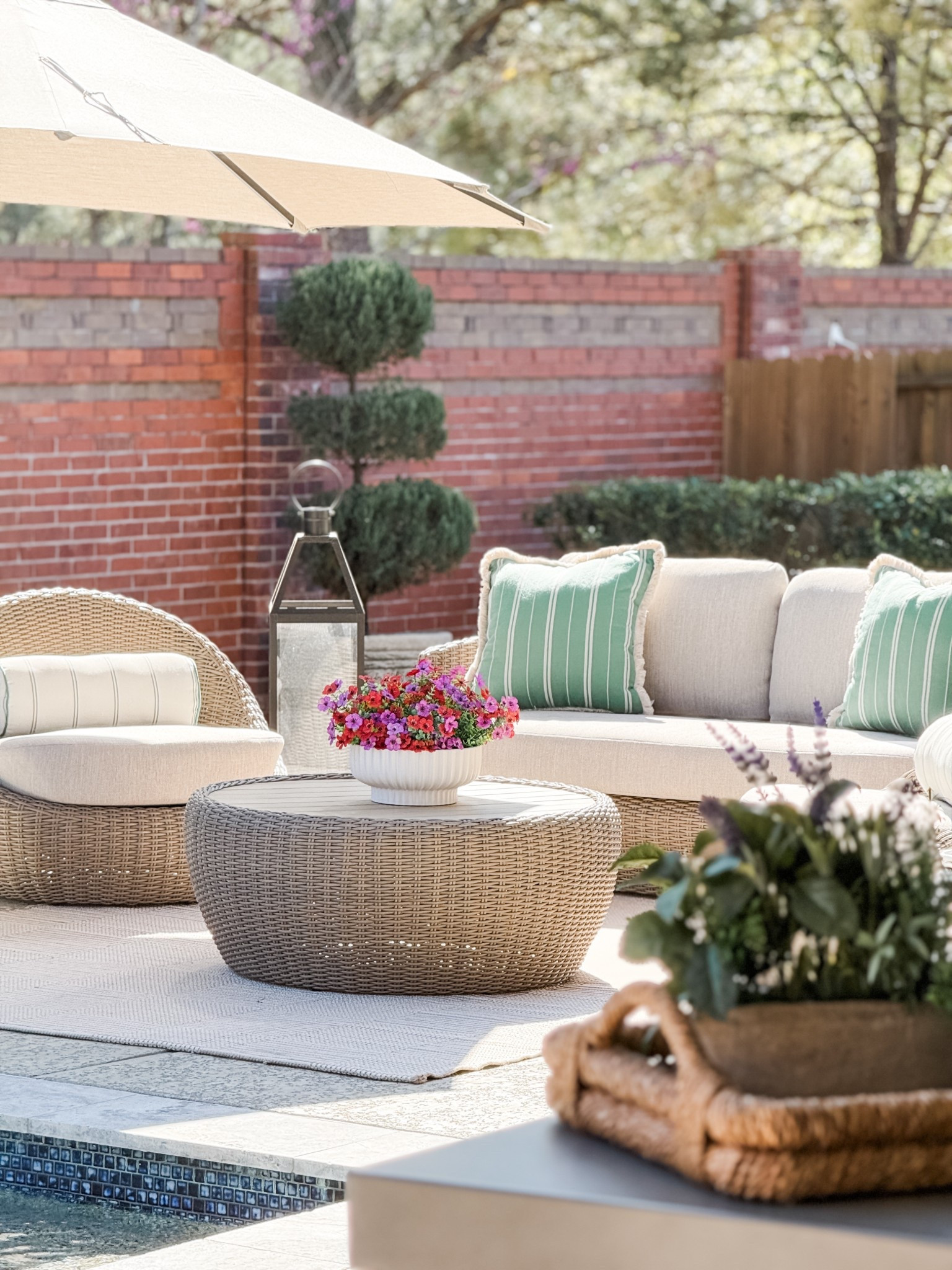 Sneak peak into my outdoor space for spring! These target outdoor throw pillows look so high end it’s unreal!! Can you believe these beautiful flowers on the coffee table are fake? I’ve linked them here! So many sales shown here 

#LTKSaleAlert #LTKHome #LTKSeasonal