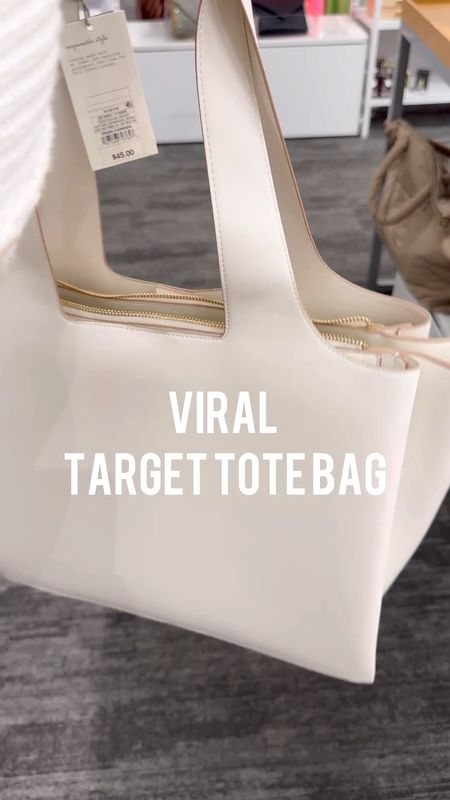 Found the viral Target tote bag!! It’s the perfect size, has three separate compartments, and pockets inside! Perfect for work, travel, everyday, diaper bag or school bag!! 

#LTKsalealert #LTKover40 #LTKitbag