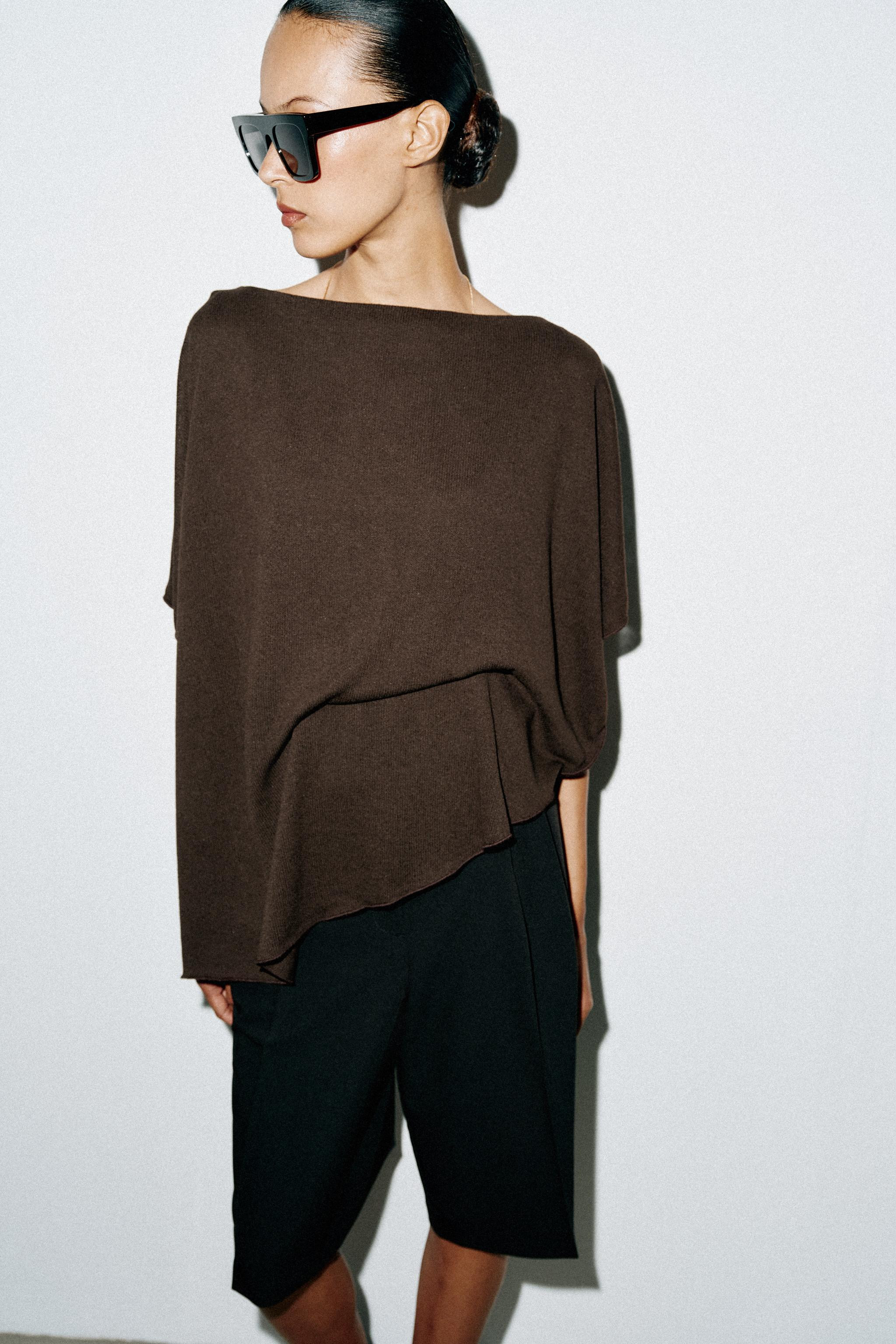 Cape-style top made from a viscose blend yarn. Features a round neck and fluid short sleeves. Asy... | Zara US