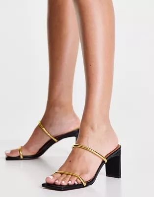 ASOS DESIGN Hamilton mid heeled mules in black and gold | ASOS (Global)