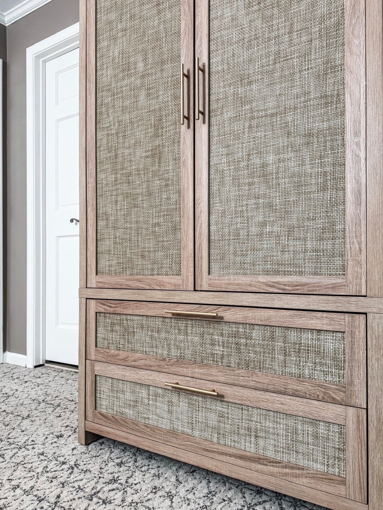 Classic storage with a textured twist 🤍 This wood armoire features beautiful woven cane cabinet doors, cane drawer fronts, and sleek brass hardware for a warm, elevated look. The mix of natural wood finish, textured woven panels, and modern brass pulls makes this piece perfect for a bedroom wardrobe, linen storage, or closet alternative. Functional drawer storage meets timeless neutral home decor—a statement piece that blends traditional style with modern organic design.

#eanesinteriors #armoire #wardrobe #bedroomstorage #wovenfurniture #canecabinet #canedrawers #brasshardware #woodfurniture #neutralinteriors #organichome #classicdesign #ltkhome #homestorage #bedroomdecor

#LTKSeasonal #LTKHome #LTKOver40