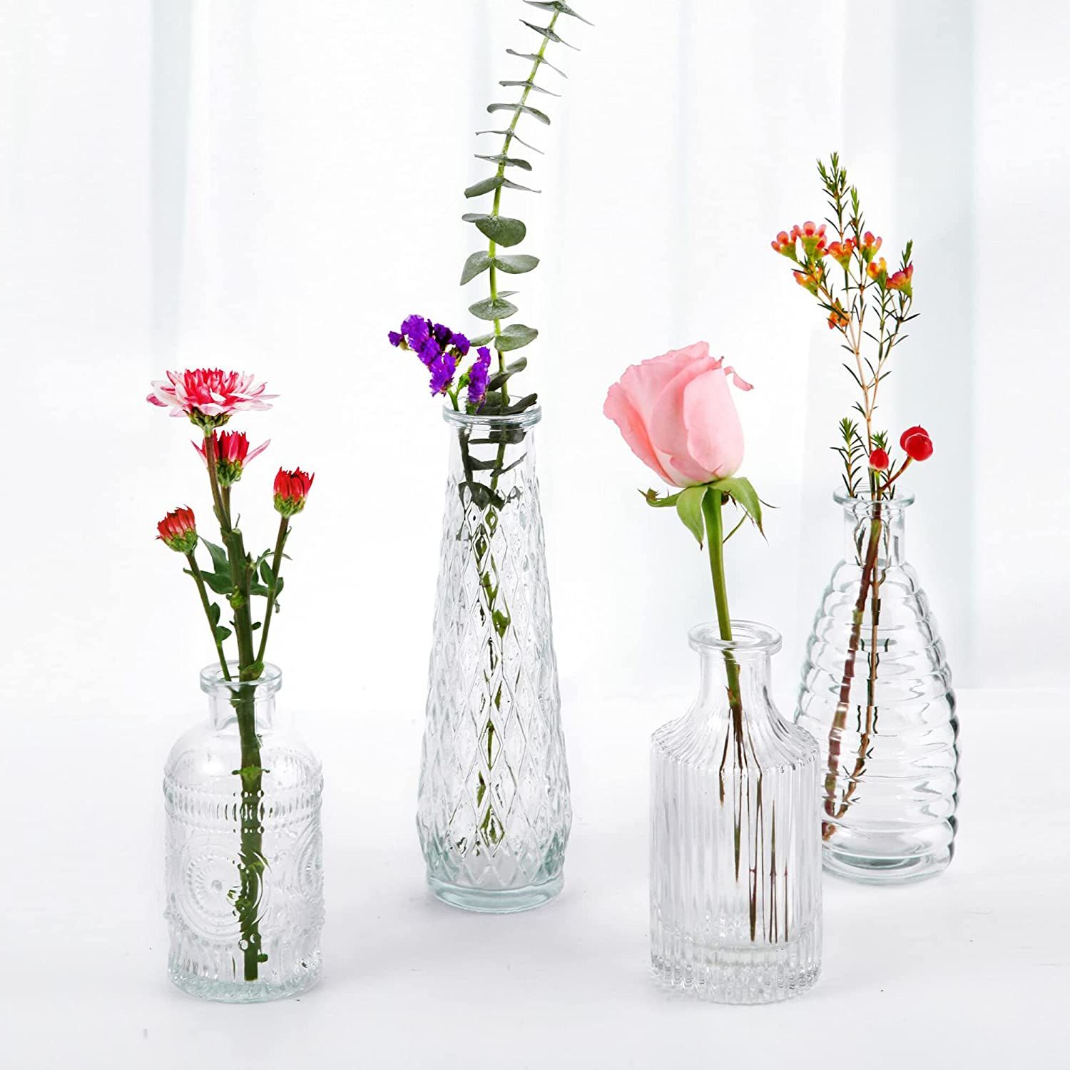 FANTESTICRYAN Simple Retro Clear Bud Vase Set of 4, Small Vintage Embossed Flower Bottle Holder f... | Amazon (US)