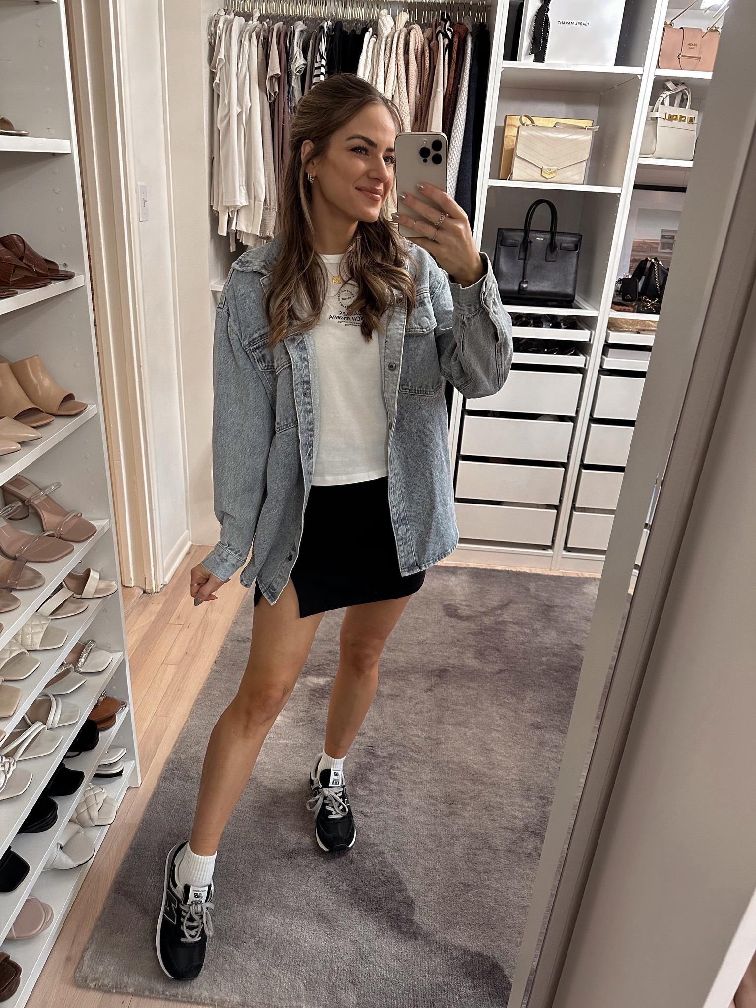 Everyday outfit inspo! Love this cute black mini skirt. I’m wearing a size S in everything & my sneakers run TTS. // AF outfit, spring outfit, spring skirt, black skirt, denim shacket 