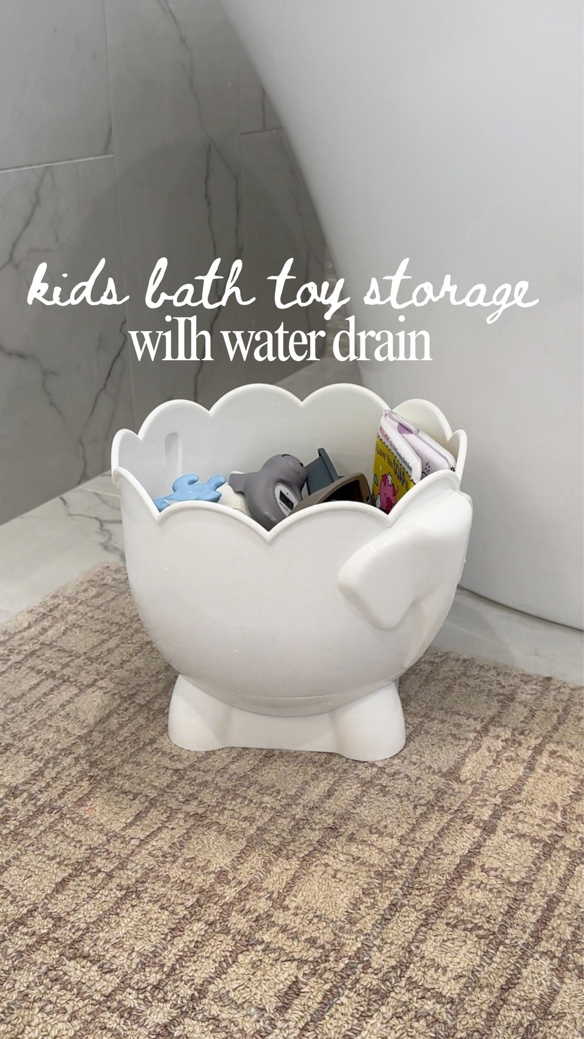 Keeping bath toys neatly stored is a breeze with this adorable bath toy storage! It's perfect for organizing and it even has a drainage feature for those days when you want to put them away quickly. #momlife #bathtimefun