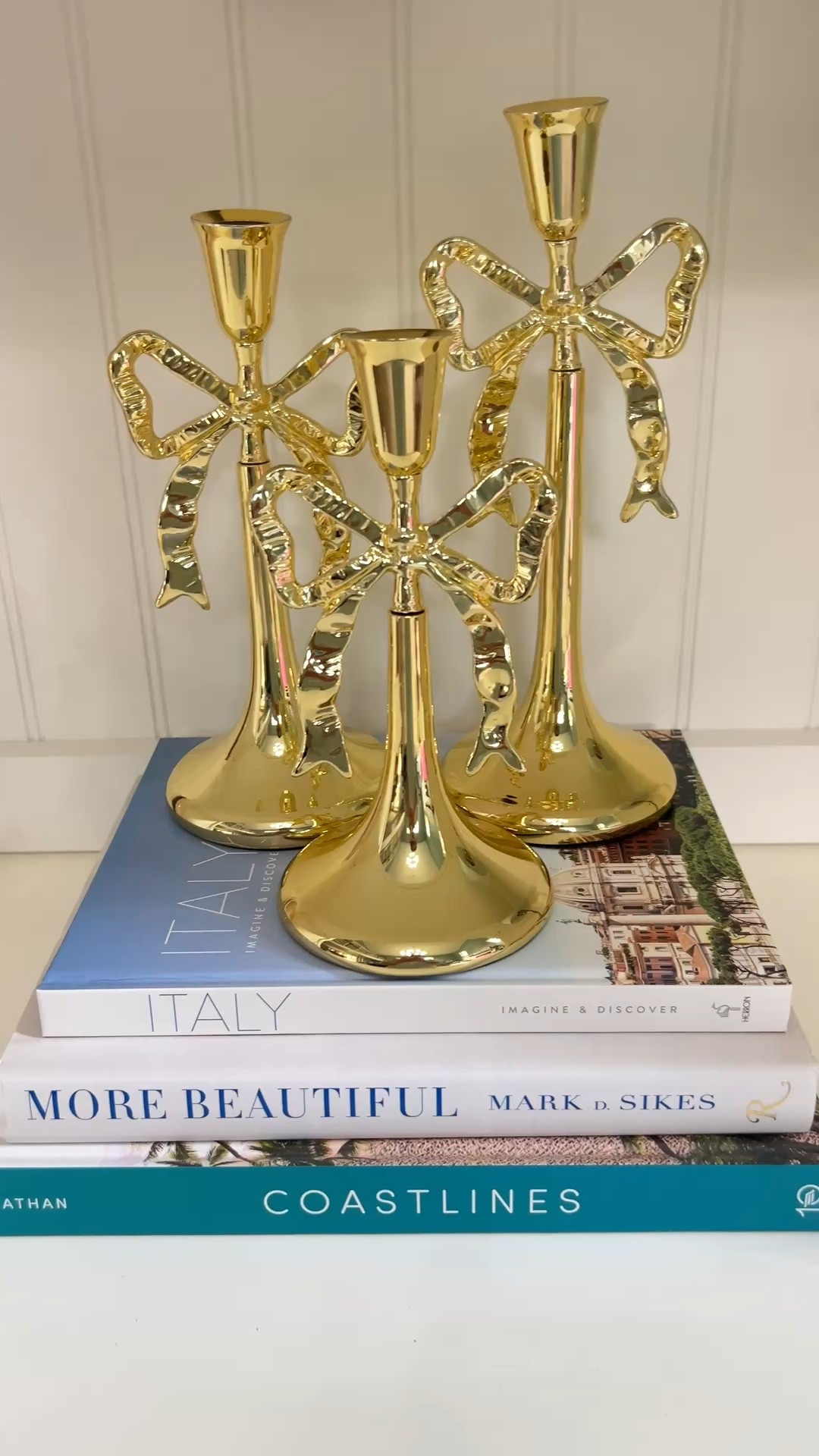 Make your centerpiece a little extra elegant with this gold ribbon candlestick holder! Love these for cozy winter dinners and even just as a decorative piece for your shelf.
shelf styling, candle holder, home accents, winter decor, holiday finds, decor inspo, table centerpiece, holiday lighting

#LTKHome #LTKSeasonal #LTKStyleTip