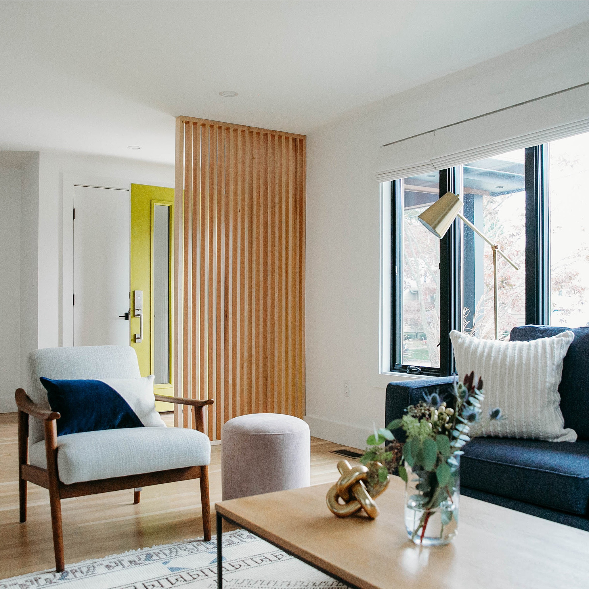 despite being a foreclosure, this #dwelloctoberrealestate mid-century modern fixer-upper had great bones and was just in need of some TLC. the floor plan flowed really nicely throughout the house and all of the rooms were a great size, so #dwelloctoberstudio kept the original layout exactly the same. in the living room, the old leaking windows were switched out for modern black ones, the wall to wall carpeting was removed, and the original hardwood floors were refinished to showcase their natural beauty.  a custom-built wood divider creates separation between the front entry and the living room and accentuates mid-century modern feel. #dwelloctober

#LTKhome