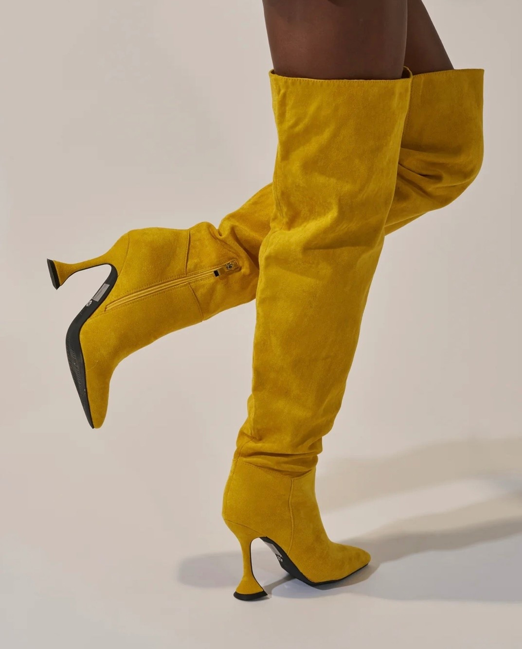 Mustard yellow suede knee-high boots with a sleek stiletto heel and pointed toe. Bold, polished. And made to elevate any look. 

#LTKSaleAlert #LTKootd #LTKgrwm