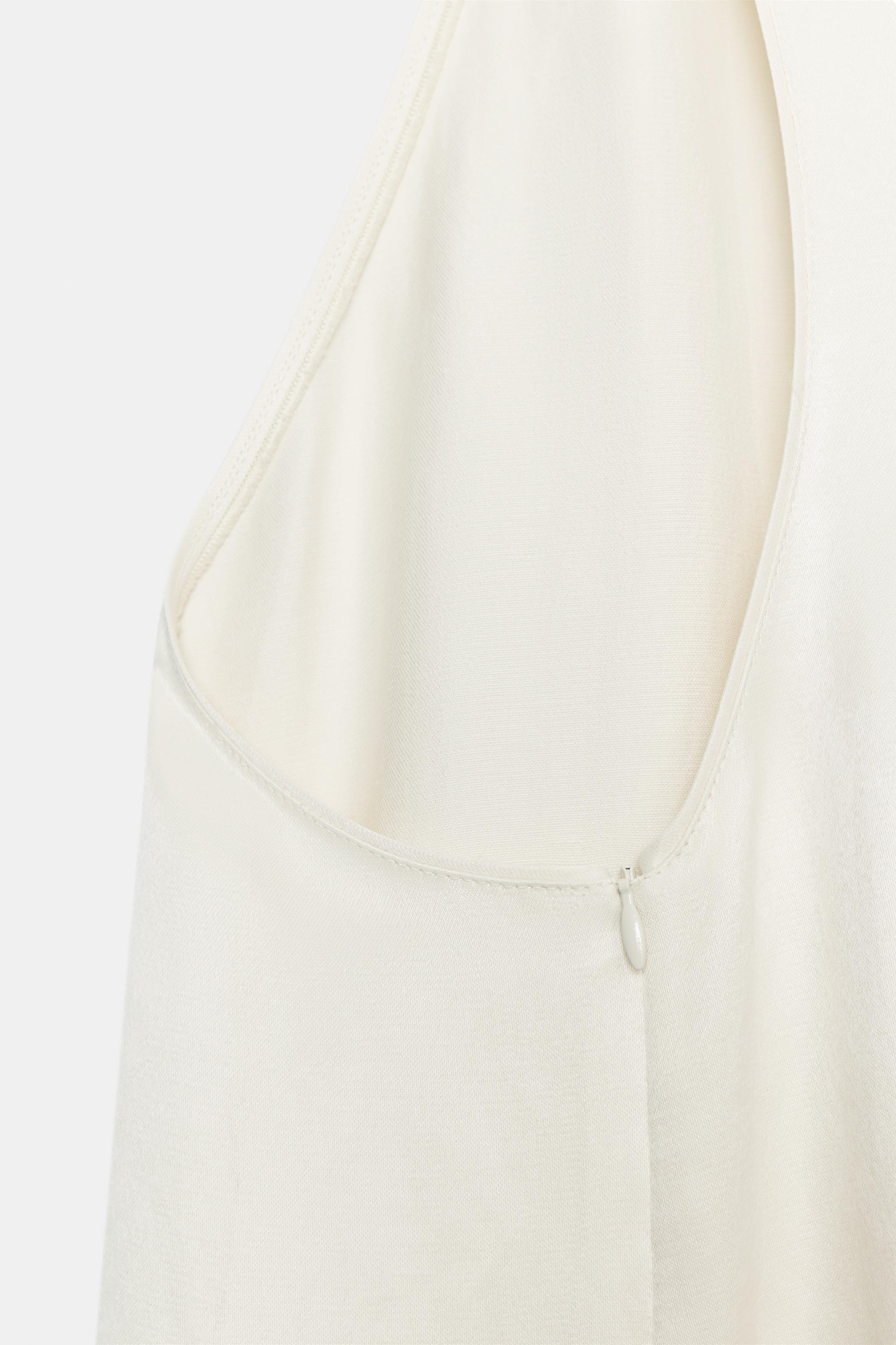 ZARA WOMAN COLLECTIONTop made with 14% linen blend yarn. Round neckline and racerback. Asymmetric... | Zara US