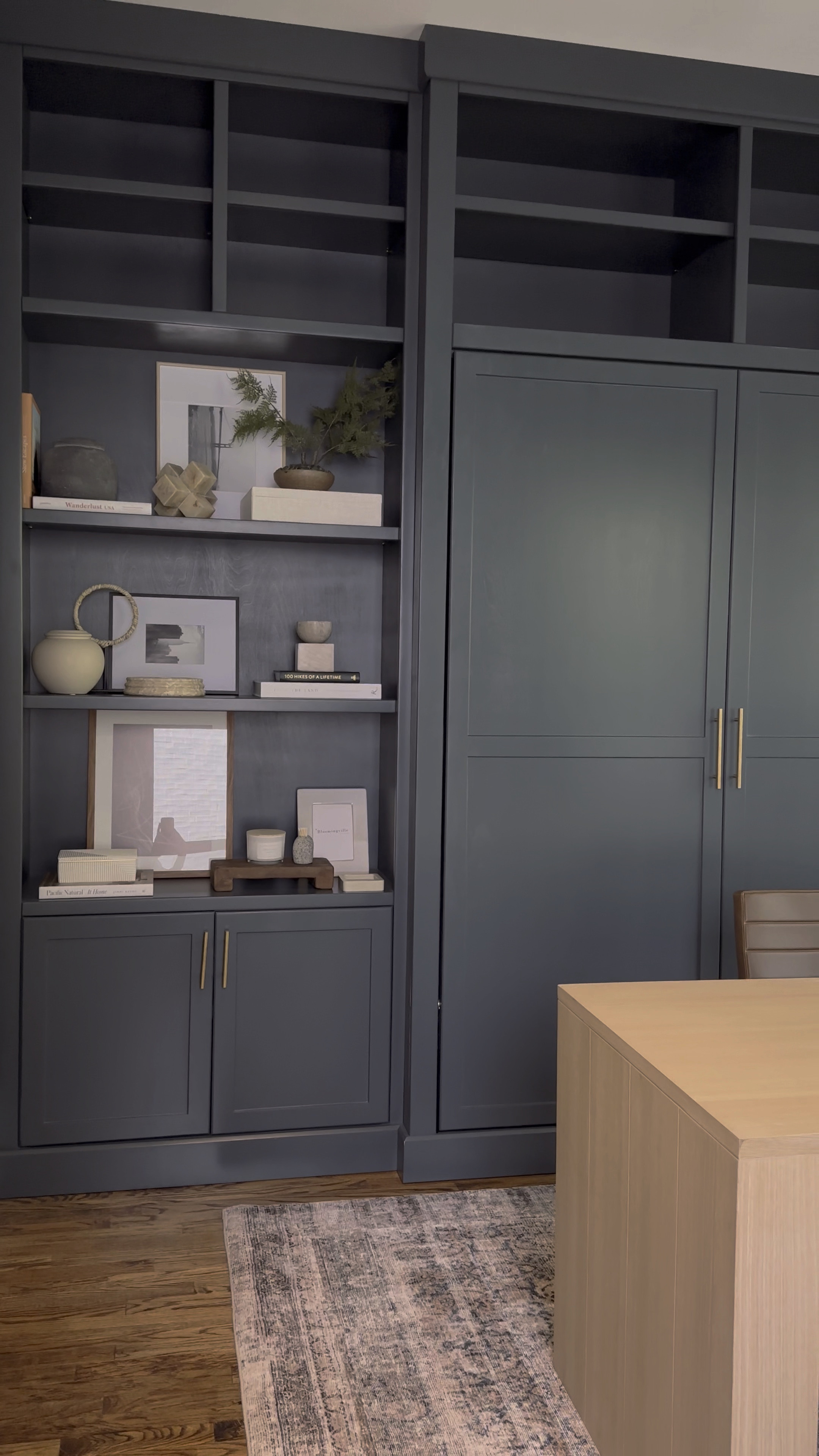 What do you get when you add custom built ins, a murphy bed, moody paint, brass hardware, natural wood hues, a leather chair, and a cozy rug? A badass home office that converts into a cozy guest suite! 😮‍💨 Shop the decor deets on my LTK. 😜

#LTKhome