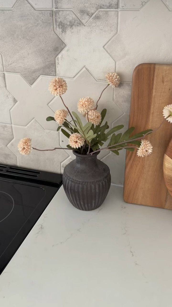 I love the pop of dark grey/black this rustic ceramic vase gives to our Airbnb kitchen from Threshold at Target - dark accents can work in a light kitchen! 

#Amazonhome
#Amazonkitchen