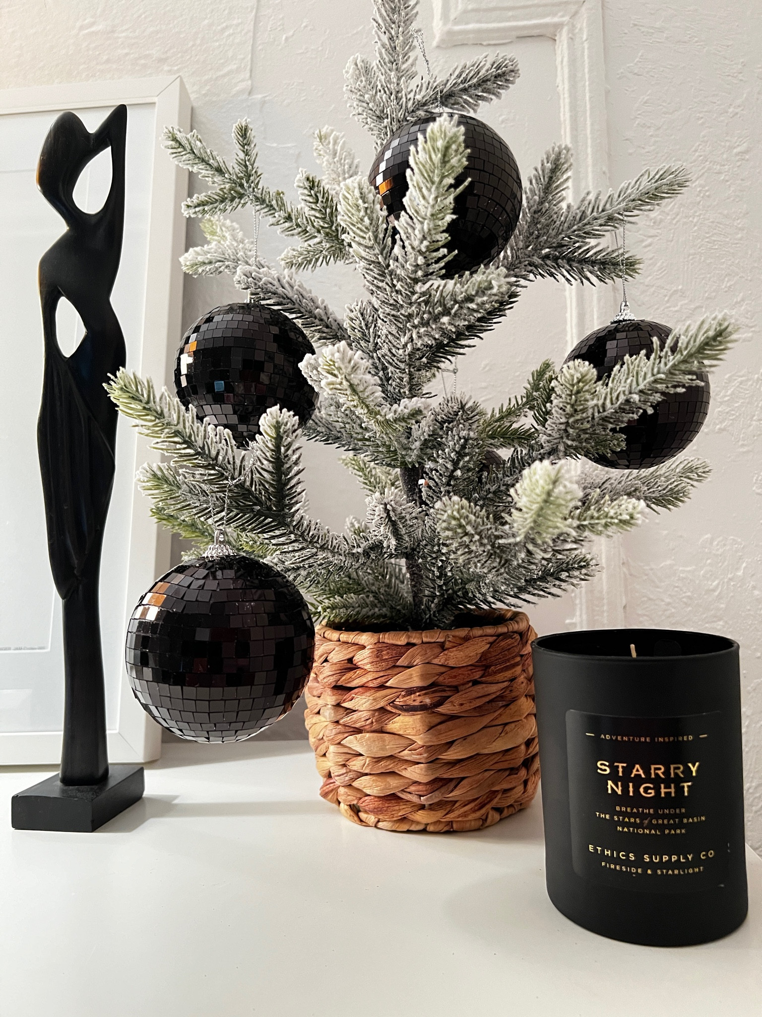 Understated Christmas decorations for normal people. Patranila decorated a small Tabletop Christmas tree. flocked Christmas tree, Glam ornaments, black ornaments #ltkseasonal #ltkover40 

#LTKFindsUnder50 #LTKHome #LTKHoliday
