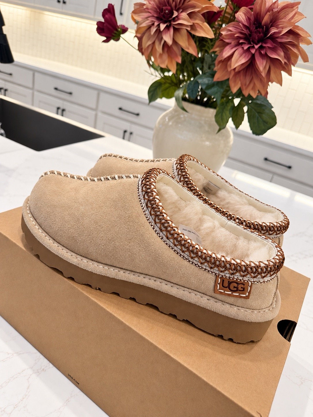 new UGG tasman in sand! The new stitching is BEAUTIFUL on these! Wearing my true size 7!