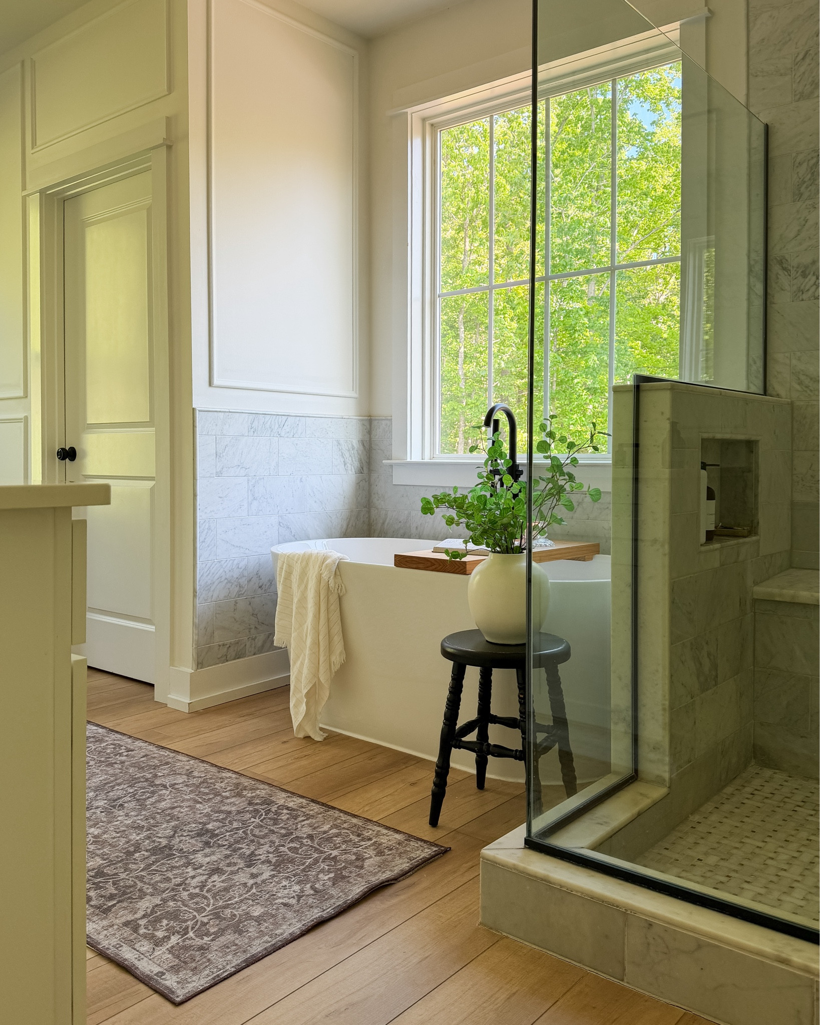 The way the green just pours into my bathroom windows is probably one of my favorite things.

I realized I hadn’t shared many pictures of this space since I added the picture moulding. I love the way it turned out. It made our bathroom look so much more custom! 