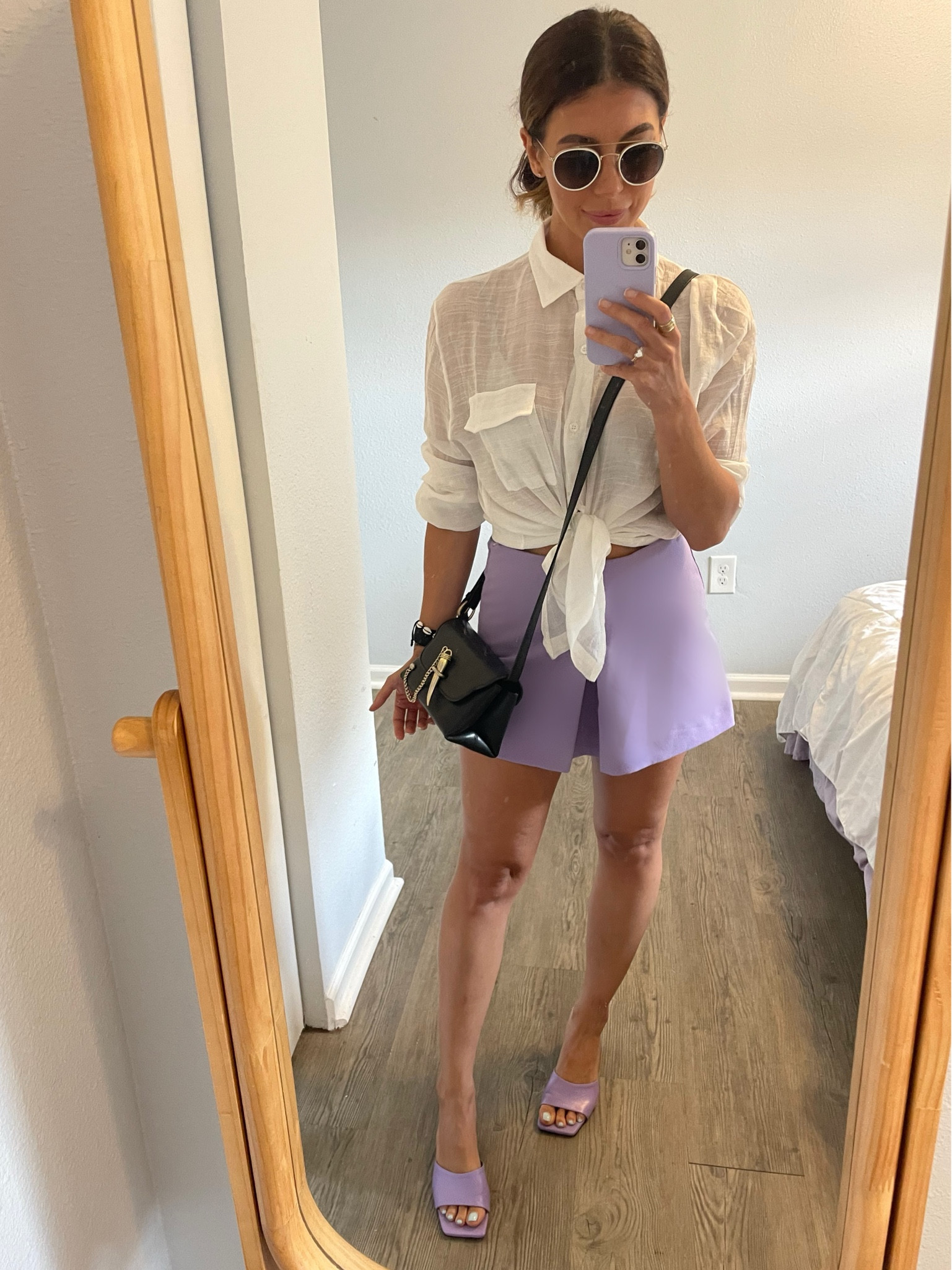 It is 89 degrees in Tampa today and my client wants to have our lunch meeting at an outdoor restaurant 🥵 I chose this gauzy button down because it’s lightweight and breathable while still looking chic and professional especially when buttoned to the top! It’s such a great little Amazon find- I also use it as a beach/pool coverup! The skirt is several years old from Zara but I linked some similar looks. You know I had to incorporate my favorite color even on the heels- they are so comfy and beautiful. My favorite pair for spring and summer 💜🤍

#LTKshoecrush #LTKSeasonal #LTKunder100