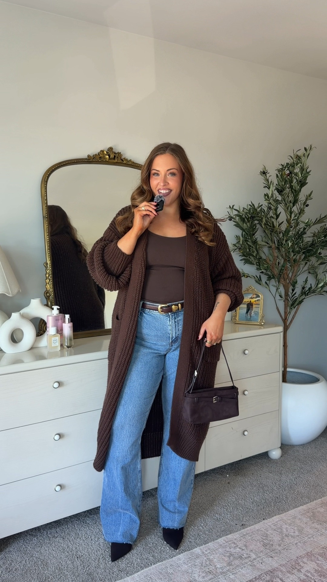 Wearing an xxl cardigan, large tank & 34L jeans