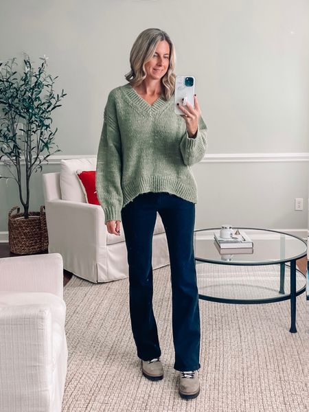 Target sweater in a small 
Holiday sweater 
Christmas sweater 
Green sweater 
Black flare jeans 
Bootcut jeans 
Winter boots 


#LTKHoliday #LTKunder50 #LTKSeasonal