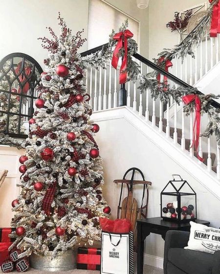 Flocked Christmas tree. Christmas staircase. Christmas decor. Classic Christmas decor. Natural Garland. Wreaths. Christmas sled. #christmasrailingdecor #christmastreedecor #christmasmantledecor #christmashomedecor #christmasgarland #holidaydecor