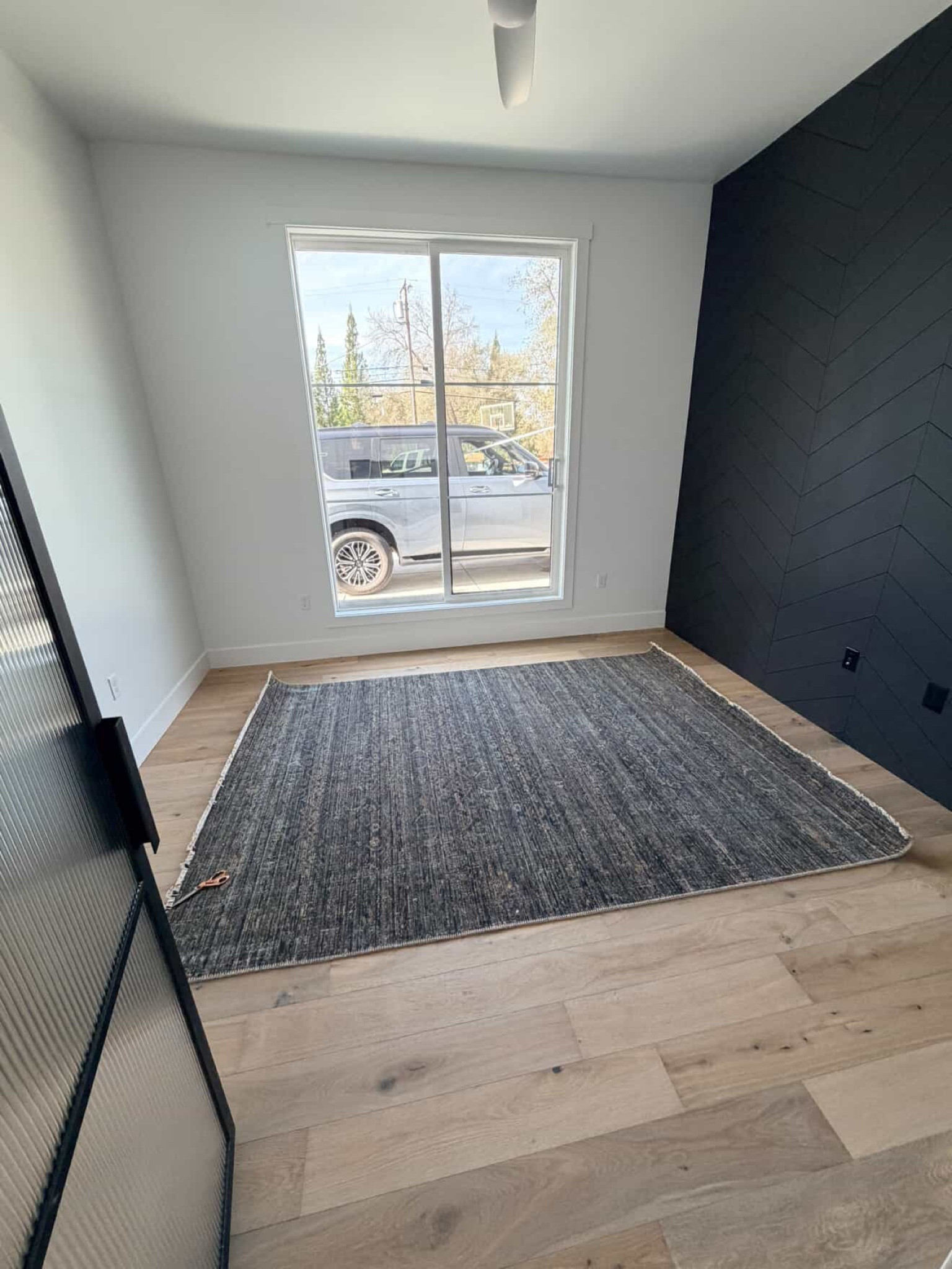 Client update:

This space originally had carpet, that has been replaced with wood flooring same as the main living space  

This rug helps ground the room and tie in the chevron accent wall which already existed. 

Desk, desk chair, ottomans and storage cabinet are being installed currently 

#LTKHome