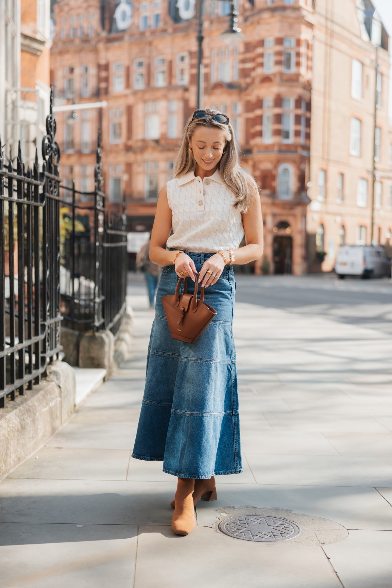 An elegant spring outfit; styling a sleeveless knit with a denim midi skirt and Vivaia boots 🪷

#LTKspring #LTKstyletip #LTKFashionMonth