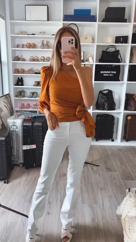 Gorgeous one shoulder blouse 
Beautiful color paired with some flattering white denim pants 
Everything runs true to size 
Wearing a size small on top and and size 2 long on the pants 

#LTKSeasonal #LTKover40 #LTKstyletip