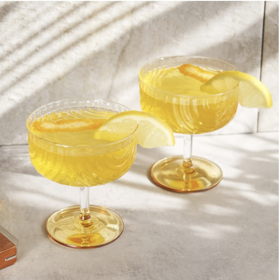 Draping glass and polished gold details give this stemmed glassware set Jazz Age flair. Made from high-quality glass with a gold-plated base, these coupes elevate any cocktail, shaken or stirred.

#LTKhome #LTKparties
