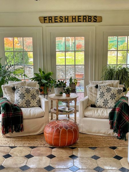 Subtle Christmas in the sunroom 

Boho farmhouse, farmhouse style, accent chairs, plaid throws, throw pillows, area rug, poof ottoman, plants, houseplants 

#LTKSeasonal #LTKHoliday #LTKhome