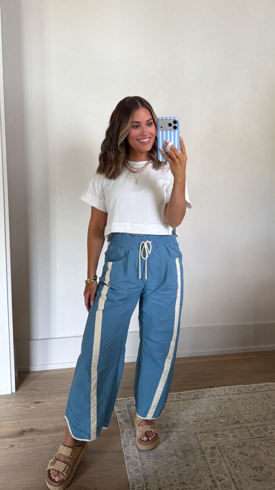 Wearing a small in these $25 track pants — come in lots of colors! Paired with an old white tee, but will link similar. Sandals run tts! 

*currently 17 weeks pregnant 

Casual style, track pants, barrel pants, bump friendly, white tee 

 

#LTKootd #LTKSaleAlert #LTKBump