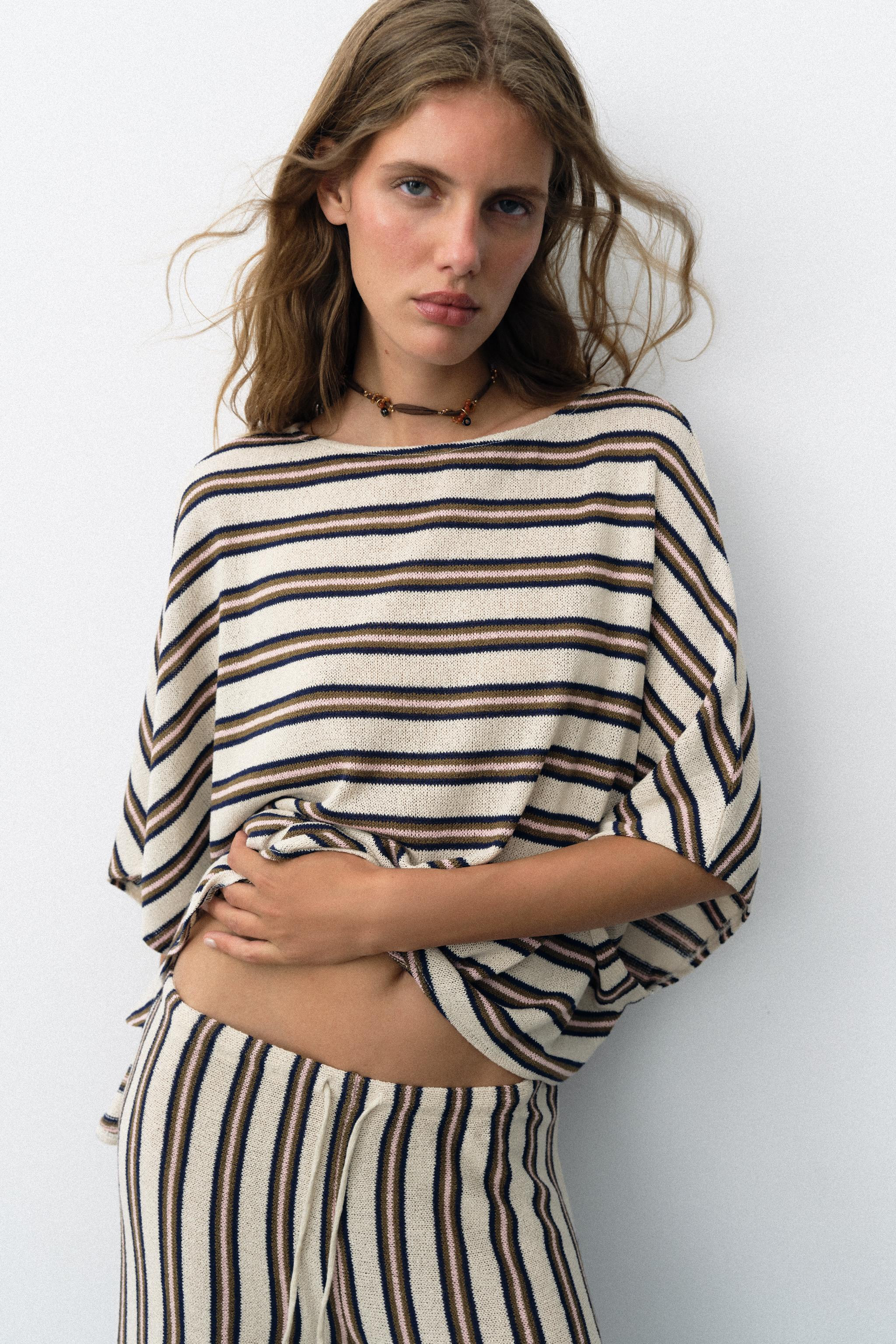 Top crafted from a rustic fabric. Features a boat neck, wide short sleeves and an asymmetric hem. | Zara UK