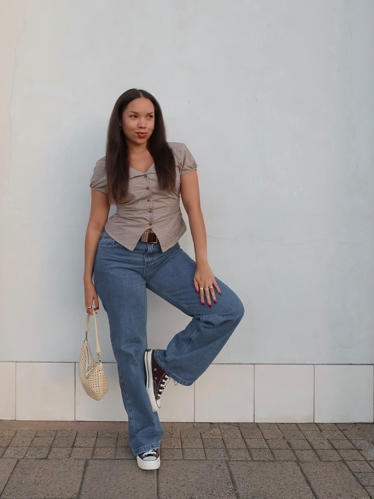 Casual fall outfit wearing a brown plaid short sleeve button up top, straight leg/baggy jeans, brown converse and a cream woven shoulder bag 🤍🤎 

#LTKFindsUnder100 #LTKSeasonal #LTKStyleTip