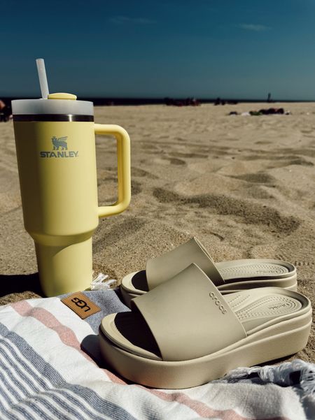 Beach day doesn’t exist without @stanley_brand quencher tumbler 💛 in pomelo color.

Beach essentials • summer slides • wedge sandals 

#LTKFindsUnder50 #LTKFamily #LTKSwim