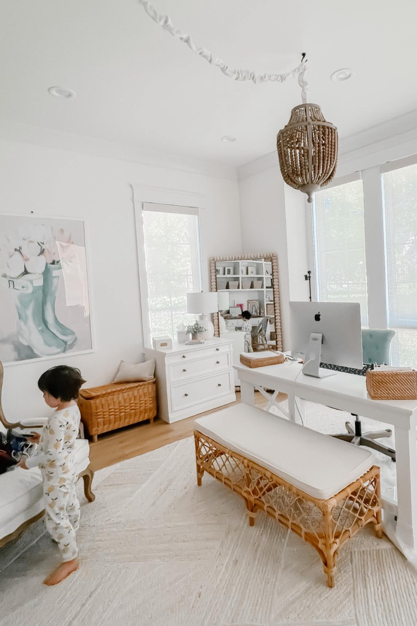 One of my favorite things about my office is how I put my printer in a basket so that you can’t see it. And then I use the little opening on the side for the cords to go through. My exact basket is sold out, but I linked one that is super similar  