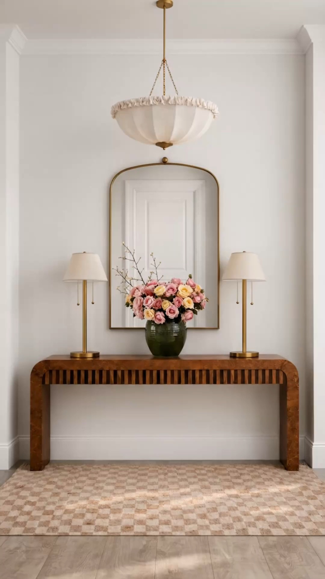 Imagine coming home to this entry — warm, inviting, and chic.

The Art Deco–inspired console makes a beautiful statement with its sculptural curved silhouette, slatted detailing, and two discreet drawers. Above, the distinctive fabric pendant brings softness and character, while the brass table lamps and mirror add a warm, polished glow. Fresh florals and the subtle checkered rug complete an entry that feels beautifully layered and welcoming the moment you walk in. Linked here.

#Entryway #EntrywayDesign #ArtDeco #ArtDecoConsole #ConsoleTable #FabricPendant #PendantLight #TableLamp #BrassDetails #CheckeredRug #FloralStyling #ModernClassic #WarmInteriors #HomeRefresh #LTKHome #LTKFestival #LTKSaleAlert

#LTKdayinmylife #LTKHome #LTKPlusSize