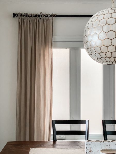 Easy beige Linen curtains. These just tie on!  This chandelier is on sale too! 

#LTKhome