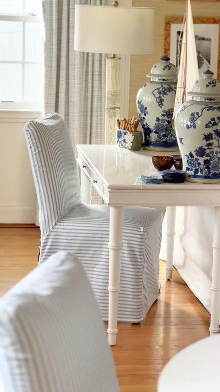 These blue and white ticking stripe slipcovered chairs are a great find and look great in a coastal interior 

#LTKVideo #LTKhome