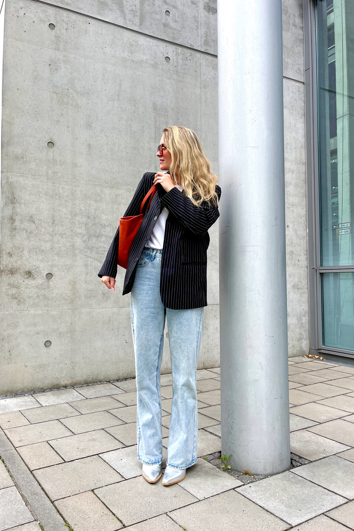 Casual Chic. Fashion Blogger Girl by Style Blog Heartfelt Hunt. Girl with blond hair wearing a pinstriped blazer, white tee, orange sunglasses, wide leg jeans, orange Michael Kors bag and silver cowboy boots. #casualoutfit #oversizedblazer #blazerstyle #colorfuloutfit #colorfulstyle #colorfulfashion #colorfullooks #fashionfun #cutesummeroutfit #summerfashion2023 #summerlookbook #fitcheck #dailylooks #dailylookbook #contentcreator #microinfluencer