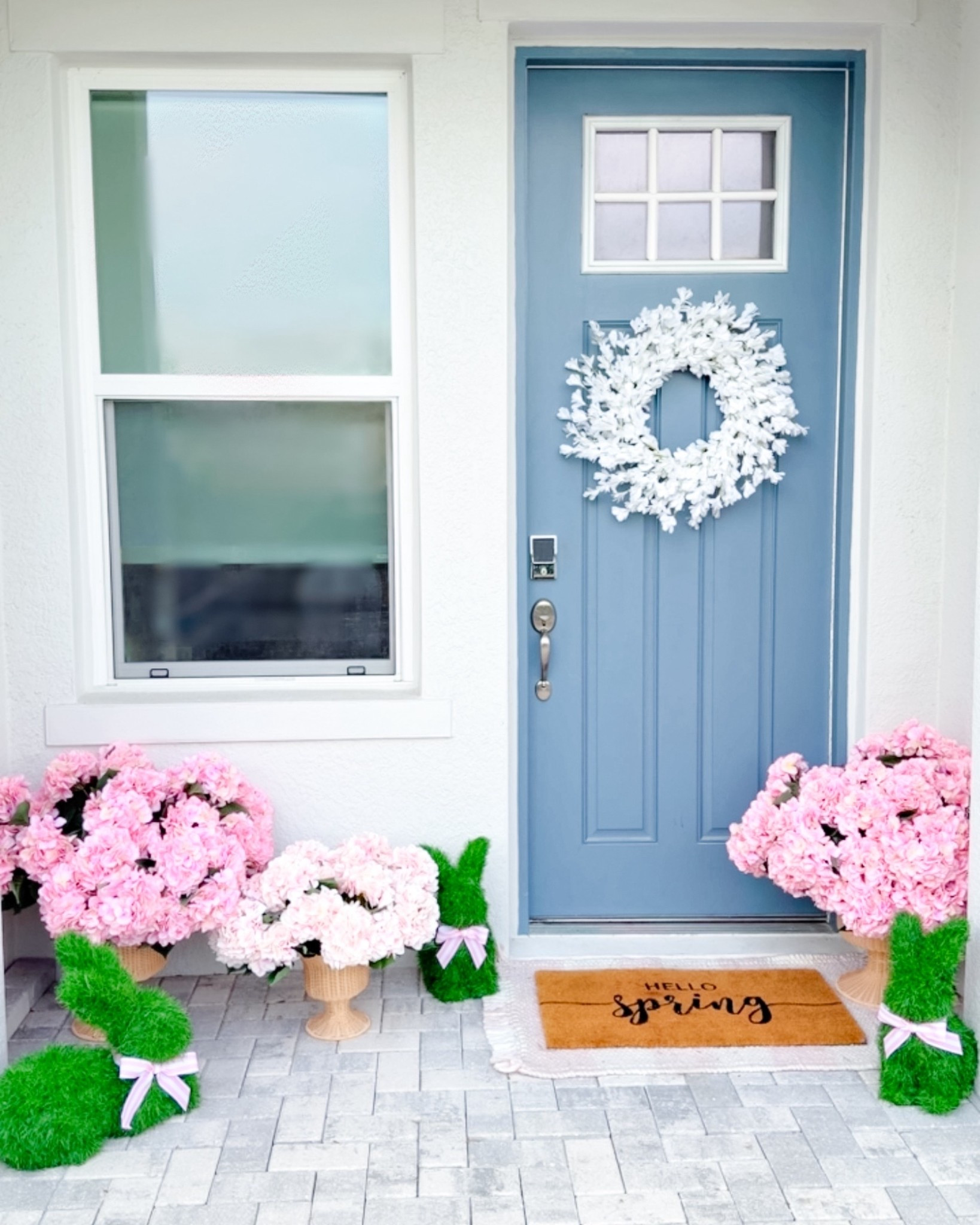 Spring Porch + Spring Patio Decor - pink artificial hydrangea flowers styled in a woven basket with adorable bunny topiaries, a matching pink plaid mat, spring welcome mat, + spring wreath for the front door. 

This is an easy way to decorate your home for spring, Easter, + summer! HURRY!!! The Easter bunny topiaries will SELL OUT! 

The fake hydrangeas come in a variety of spring colors. This only took me a few minutes to put together and decorate our front porch/ patio. I arranged the hydrangea flowers into the foam blocks and then placed each set in a basket.

#LTKHome #LTKSeasonal #LTKSaleAlert