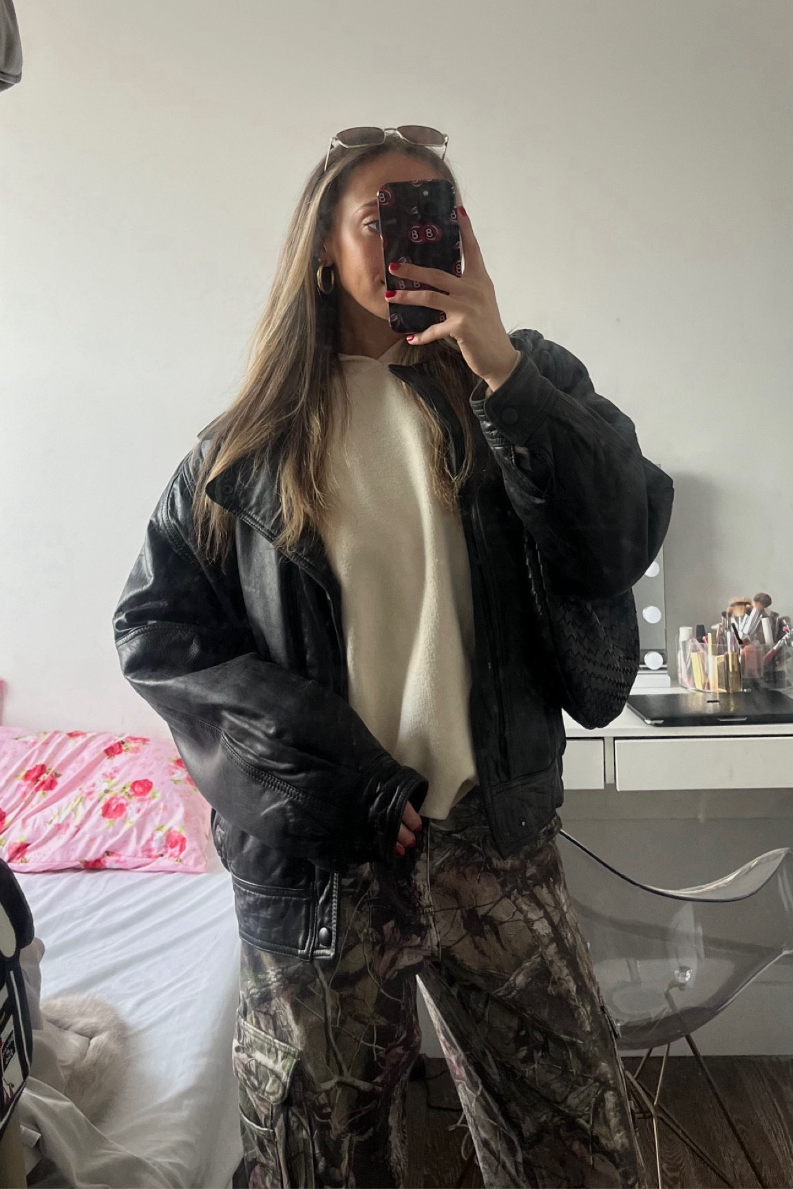 winter street style. danielle guizio camo pants, cream sweatshirt, oversized leather jacket look

#LTKitbag #LTKstyletip #LTKSeasonal