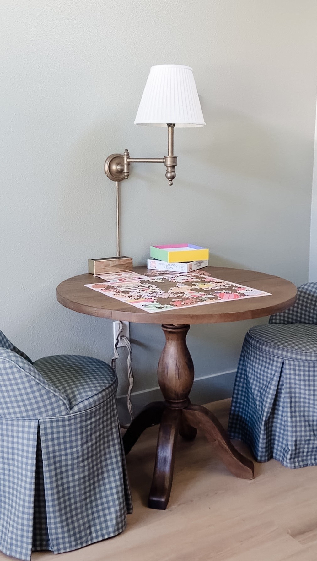 I turned an unused corner in our game room into a puzzle and game nook and we have been loving it 🧩